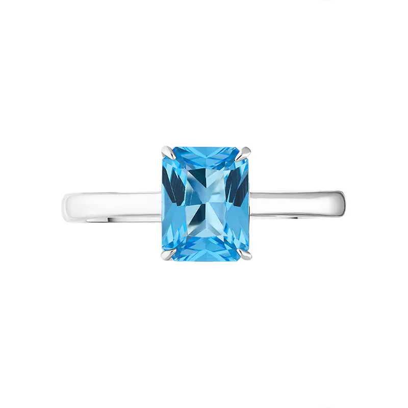18ct White Gold Blue Topaz Emerald Cut Solitaire Ring D