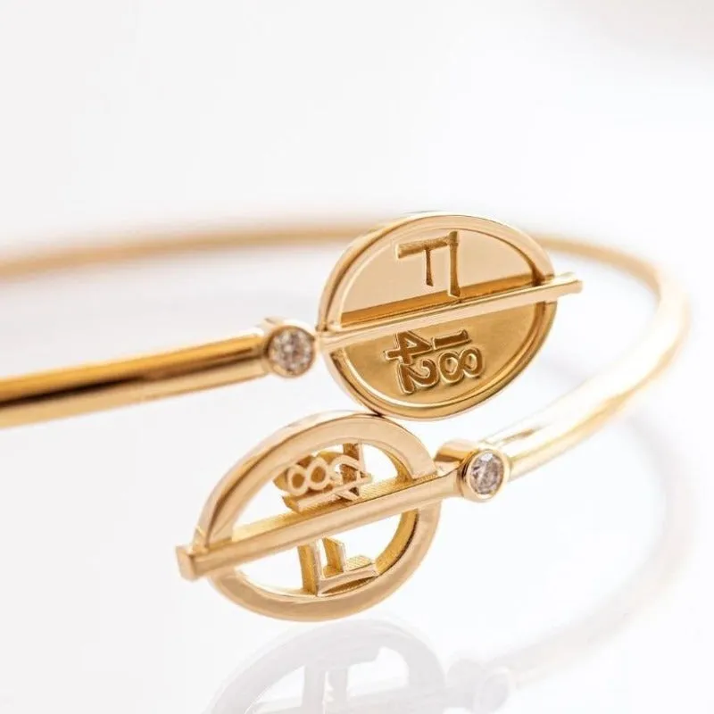 Faberge 1842 18ct Yellow Gold Diamond Egg Crossover Bracelet